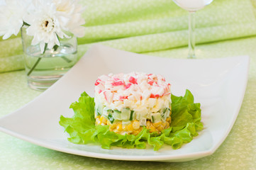 Layered salad of crab sticks and corn