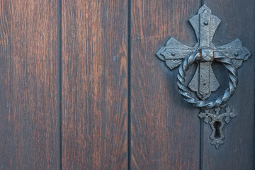 Detailed view on old church door and door knob