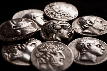Pile of ancient greek silver coins closeup
