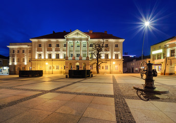 Main square Rynek and City Hall of Kielce, after sunset.