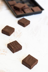 Chocolate candies on white table