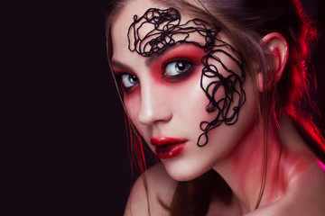 Fototapeta premium Art make up.Woman portrait with creative make up, Sexy Beauty Girl with purple-red Lips and eyes. Provocative Make up. Luxury Woman with Green Eyes. 