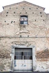 Detail of an old metal door, historic middle town italian city