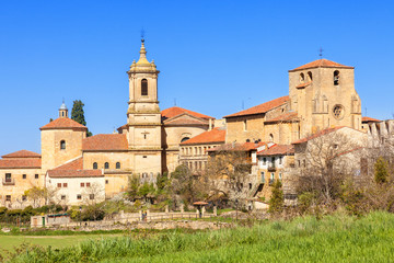 Fototapeta na wymiar Monastery of Santo Domingo de Silos in the province of Burgos, Spain. St. Peter church on the right