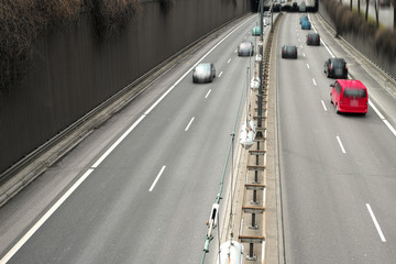 Cars on a Highway.Vehicle traffic on a busy city road in perspective.