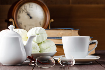 Cup of tea near old books
