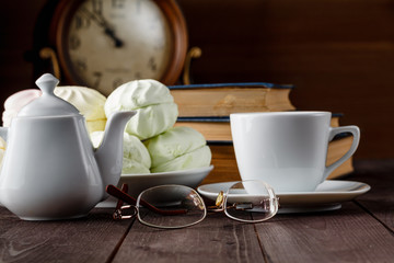 Cup of tea near old books