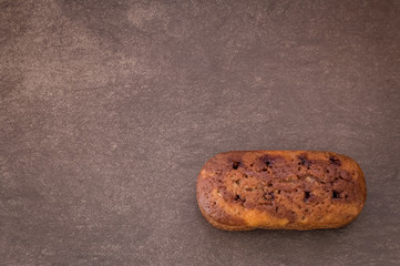  cake with jam on light brown background 