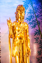 Fototapeta na wymiar Golden Statue of Kuan Yin .