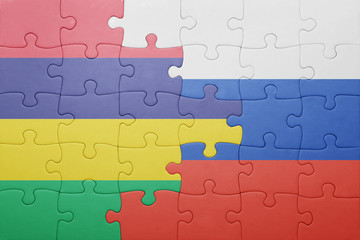 puzzle with the national flag of russia and mauritius .