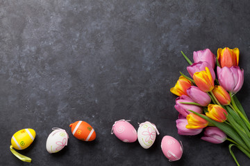 Colorful easter eggs and tulips
