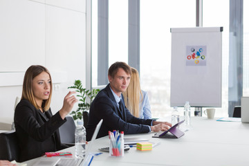 Business people having meeting in modern office.