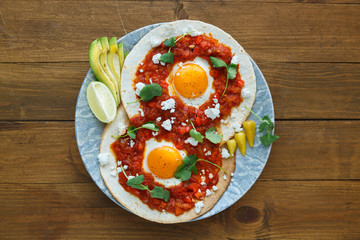 huevos rancheros closeup on the table, horizontal view from above - 104783312
