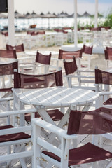 Closeup tables in outdoor summer cafe