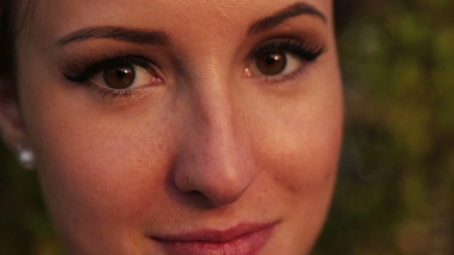Beautiful brunette bride looks into the camera close up