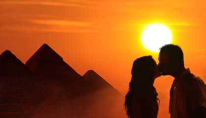 Backlit loving couple honeymoon in Egypt
