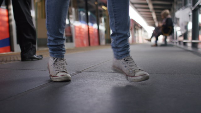 Happy feet of somebody dancing on a train platform