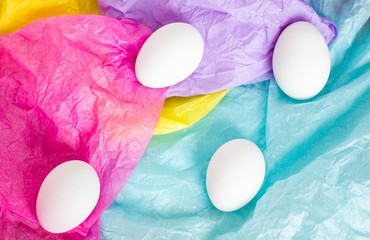 white eggs on a pastel background 