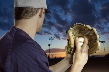 Baseball pitcher ready to pitch in an evening baseball game - Powered by Adobe