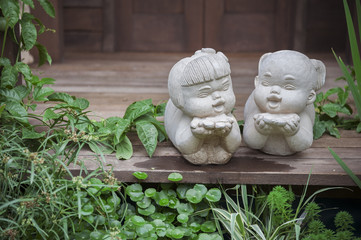 white stone boy and girl love couple sculpture decorate in garden