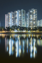 Fototapeta na wymiar highrise Residential building in Hong Kong city at night