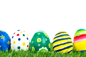 Easter Eggs on Fresh Green Grass over white background