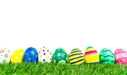 Fototapeta na wymiar Easter Eggs on Fresh Green Grass over white background