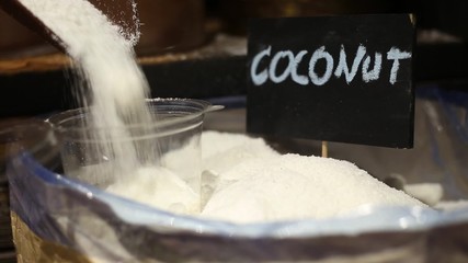 Buying coconut in the market - Powered by Adobe