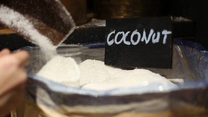 Buying coconut in the market - Powered by Adobe