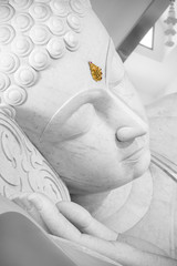 beautiful white sleeping peace buddha face.