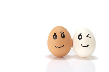 white and brown egg couple in the white