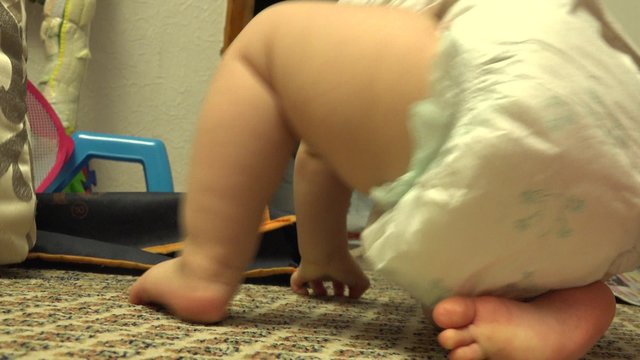 Funny Newborn in Headstand Posture. Closeup. 4K UltraHD video.