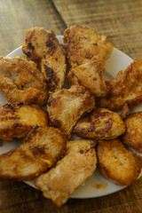 Top View Fried Pieces of Chicken Lying on White Plate