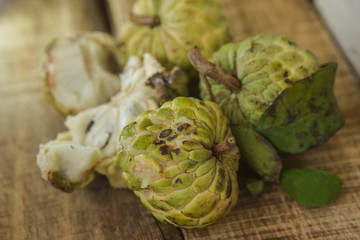 Closeup Broken and Unbroken Ripe Sugar-apples on Table