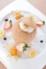 Coconut jelly with ice cream on a fruits plate