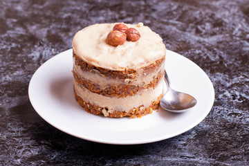 homemade carrot cake on a white plate