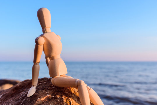 Wooden dummy at the sea