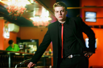 Handsome man in suit at bar
