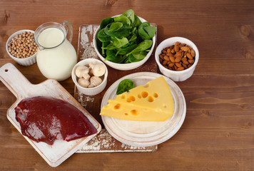 Food sources of vitamin B2 on a wooden background. Healthy eatin
