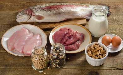 Food high in protein on a wooden table.