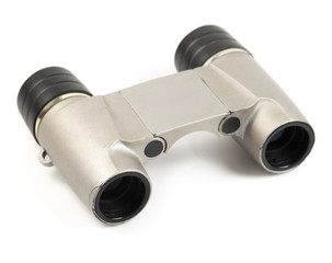 binocular lying on a white