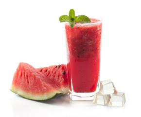 glass of fresh watermelon juice on wood