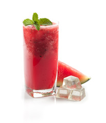 glass of fresh watermelon juice on wood