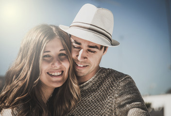 Smiling couple looking at camera