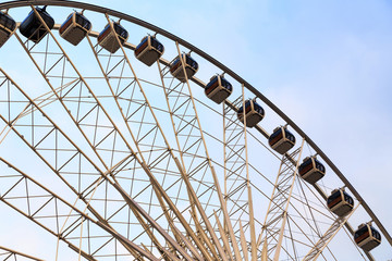 Holiday Ferris Wheel on blue sky background.