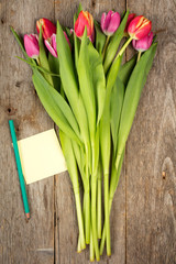 Tulip bouquet and blank sticky note