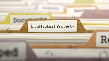 Intellectual Property on Business Folder in Multicolor Card Index. Closeup View. Blurred Image. 3D Render.