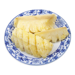 Yellow pineapple on plate isolated on white