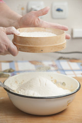 Women's hands preparing flour before baking pie