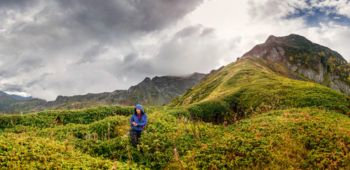 Obraz premium Freedom traveler woman standing and enjoying a beautiful nature of Caucasus mountains